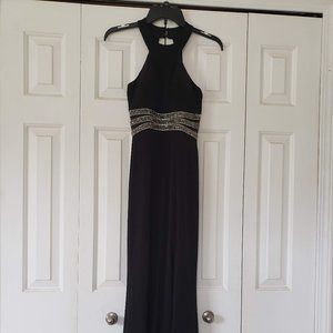 Black micro-knit, halter-style gown with cut-outs & silver accents